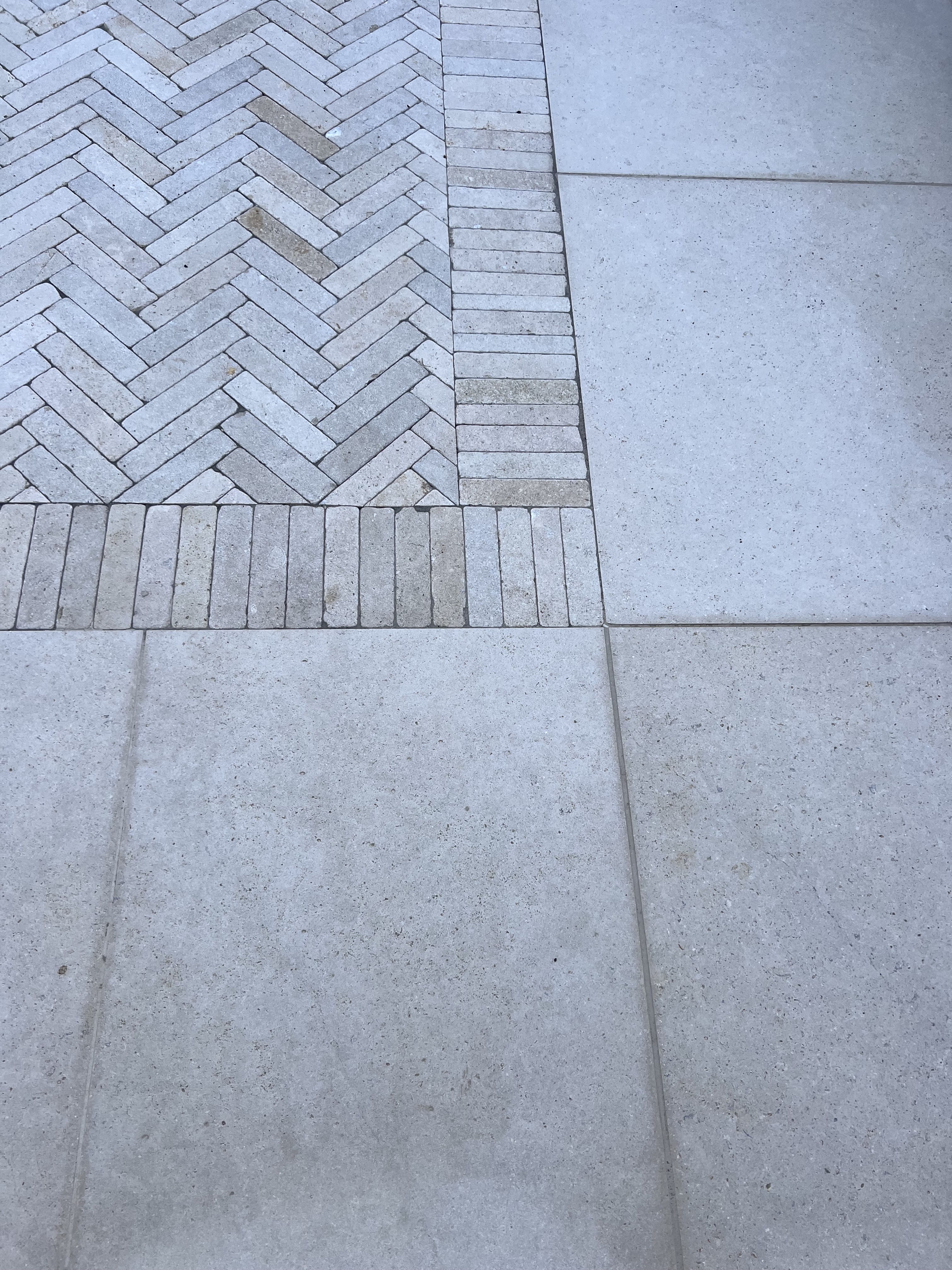An image of a herringbone paving design using Egyptian Limestone